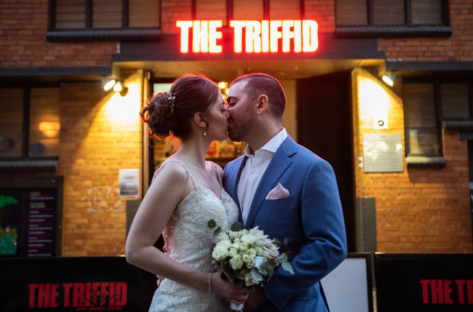 couple getting married out the front of the Triffid